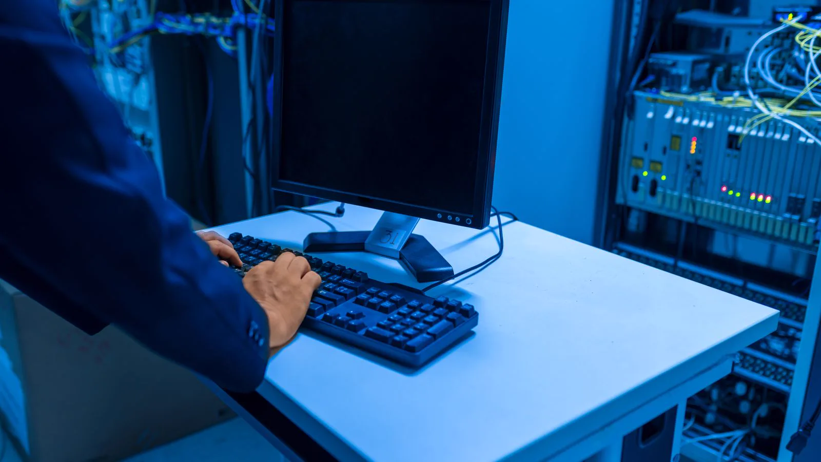 Lynn-Tech technician at work on a structured cabling installation